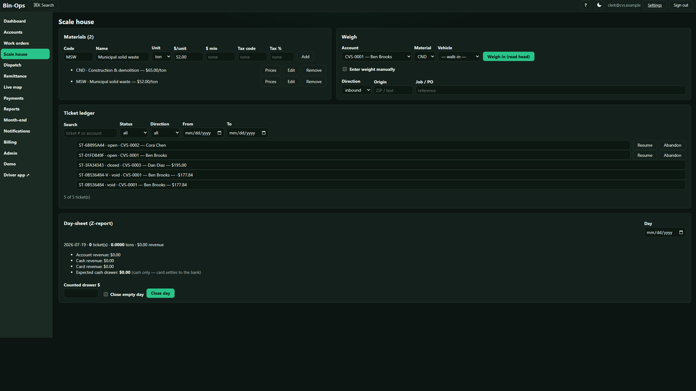 The scale house screen: material prices per ton, a weigh-in form, the day’s ticket ledger, and the end-of-day cash report.